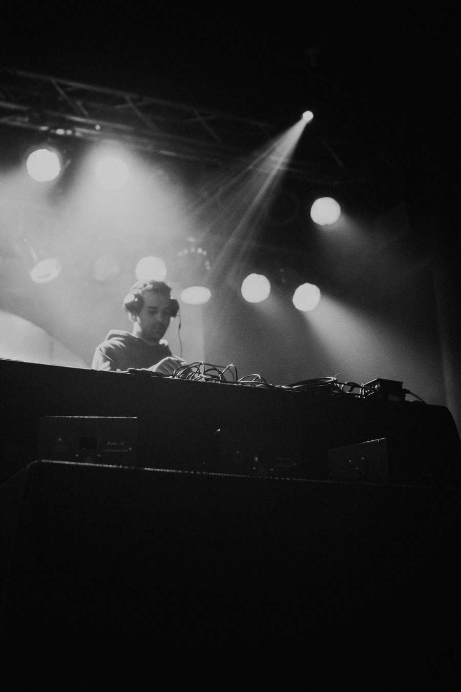 Davin mixing beneath stage lights at a live event