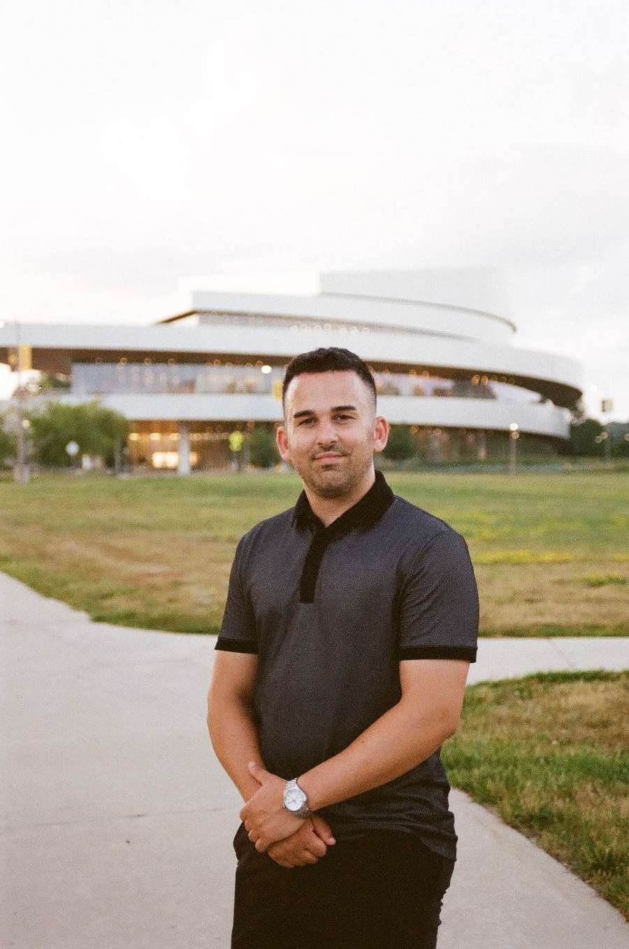 Portrait of Davin Titus outside Hancher Auditorium in Iowa City