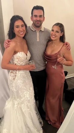 Davin with a bride and a bridesmaid, all smiling