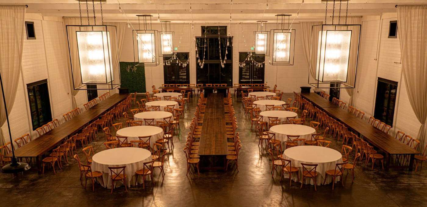 A wedding reception room set for dinner before guests arrive